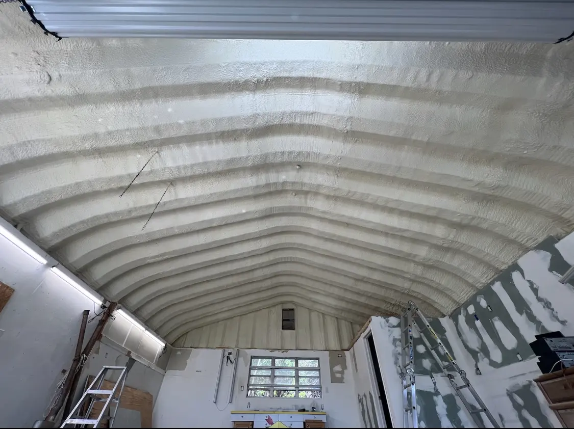Spray polyurethane foam applied to the underside of a metal roof deck in Green Brook